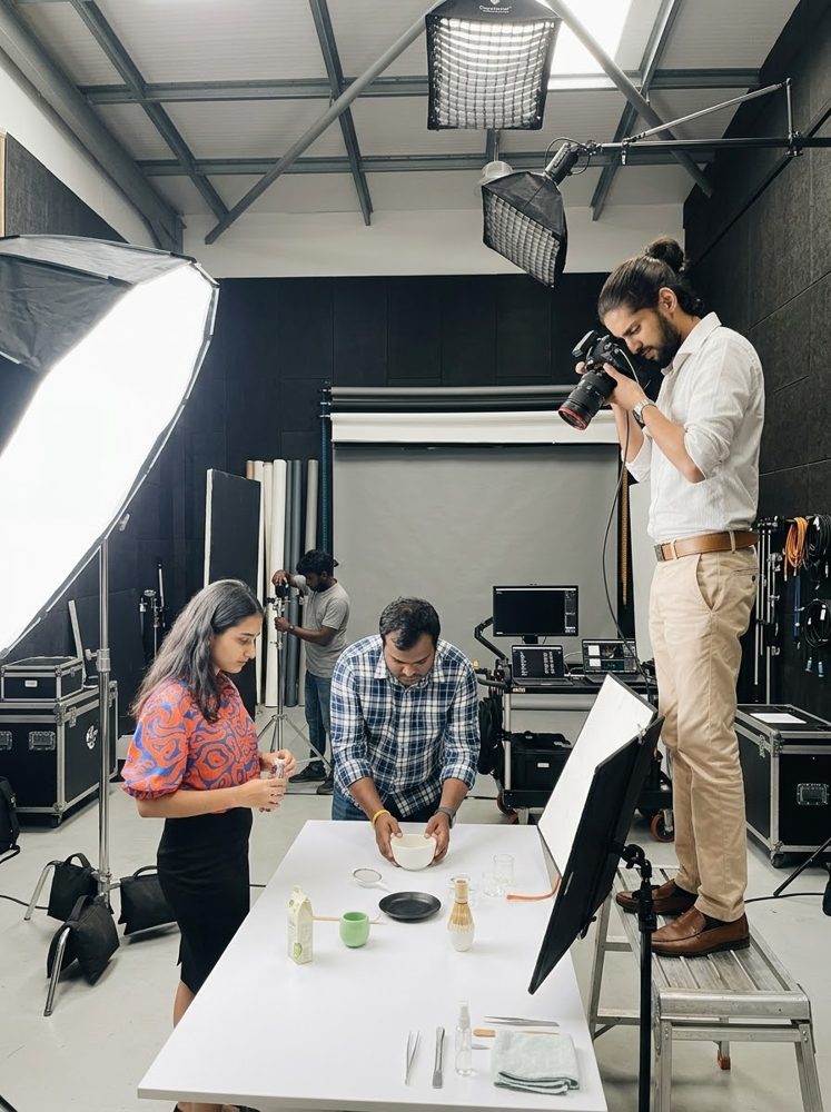 Photographer shooting a tabletop product setup