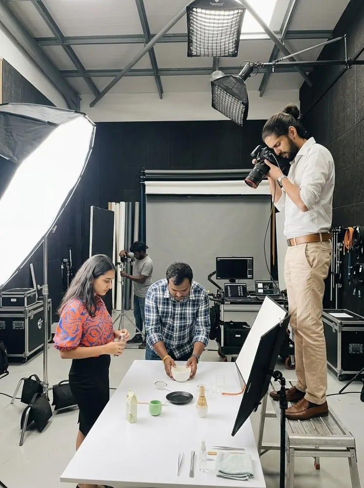 Photographer shooting a tabletop product setup