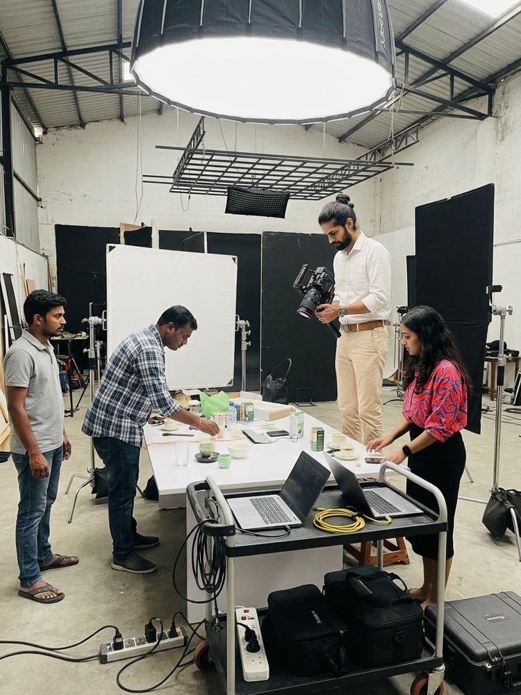 Crew preparing a product shoot with a cinema camera